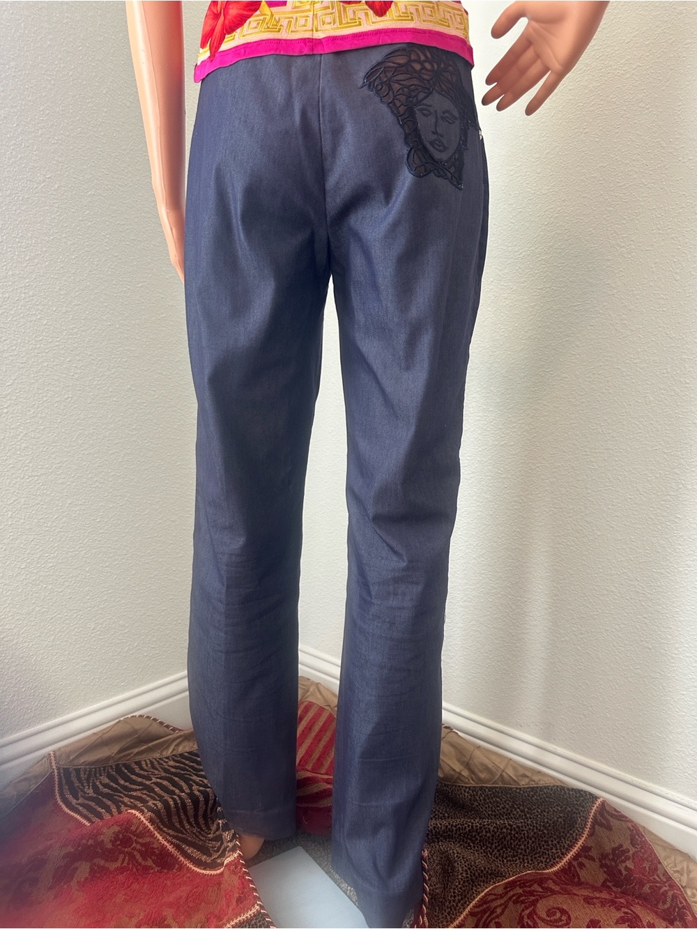 VERSACE slacks with VERSACE see thru signature Medusa head on rear pocket.